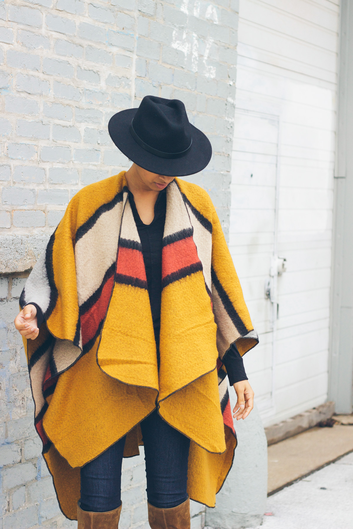 How To Wear A Poncho Without Being Overwhelmed Lows to Luxe